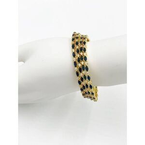Faux sapphire and diamond gold tone bangle set